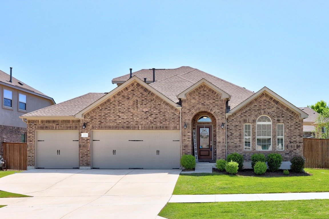 3333 Pauling Loop Round Rock, TX 78665 - Photo 1 of 1 a front view of a house with garden