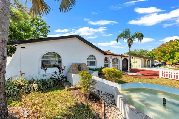 a front view of house with yard outdoor seating and entertaining space