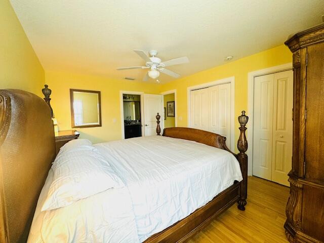 4334 Highway 441, Unit 6 Okeechobee, FL 34974 - Photo 9 of 15 a bedroom with a bed and wooden floor