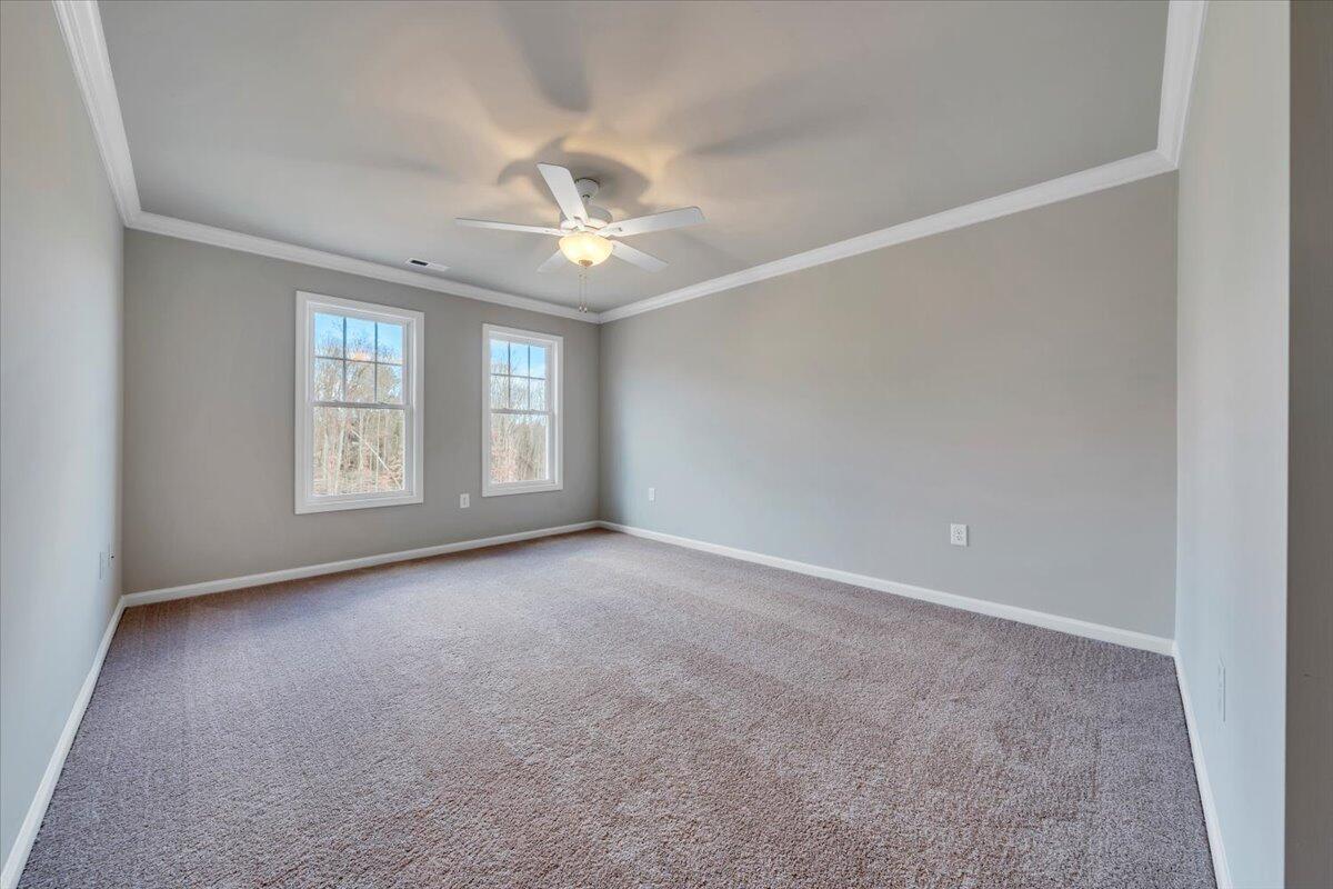 3711 Crescent Ridge Drive Southwest Roanoke, VA 24015 - Photo 10 of 23 an empty room with windows and ceiling fan
