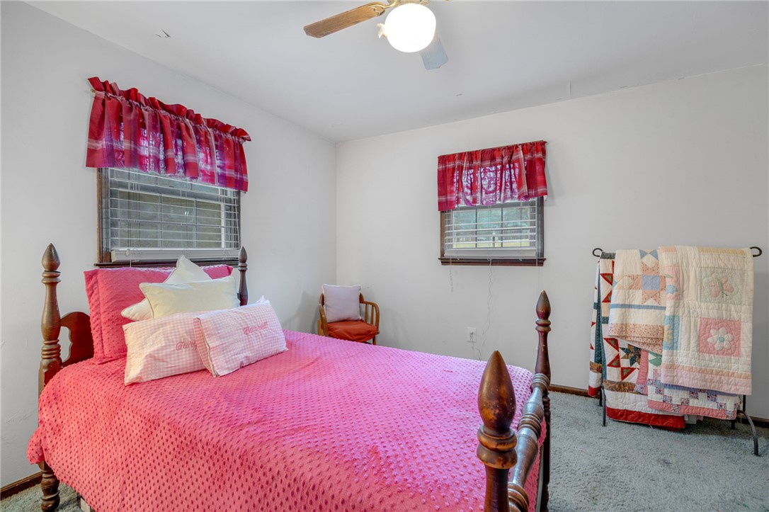 131 Bowen Road Anderson, SC 29621 - Photo 22 of 36 Double windows fill this carpeted bedroom with natural light.