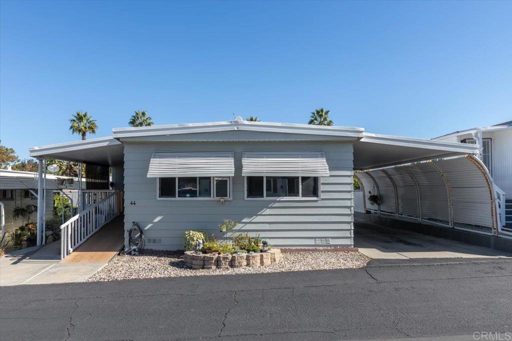 718 Sycamore Avenue, Unit 44 Vista, CA 92083 - Photo 2 of 24 a view of a house with a patio