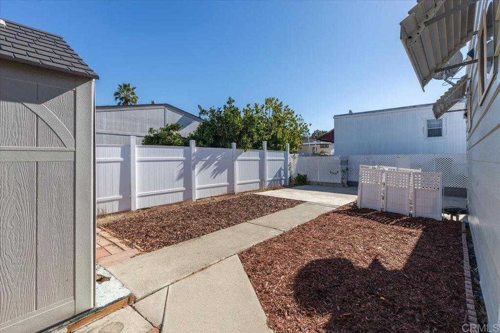 718 Sycamore Avenue, Unit 44 Vista, CA 92083 - Photo 21 of 24 a view of a backyard of the house
