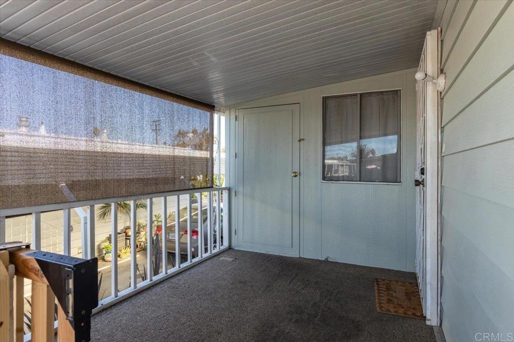 718 Sycamore Avenue, Unit 44 Vista, CA 92083 - Photo 3 of 24 a view of an empty room with a window