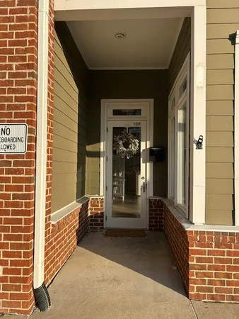 a view of a porch with a door