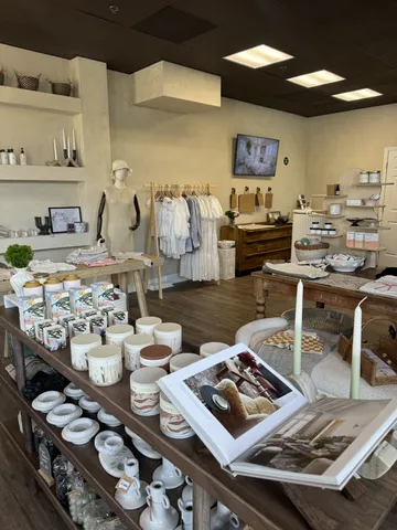a living room with lots of furniture and a wooden floor