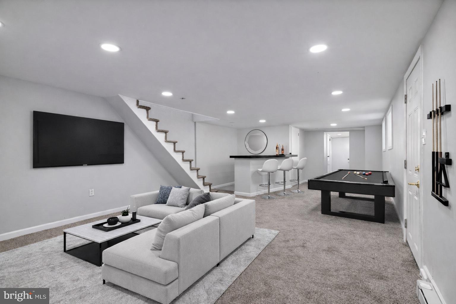2414 77th Avenue Philadelphia, PA 19150 - Photo 19 of 25 a living room with furniture and a flat screen tv