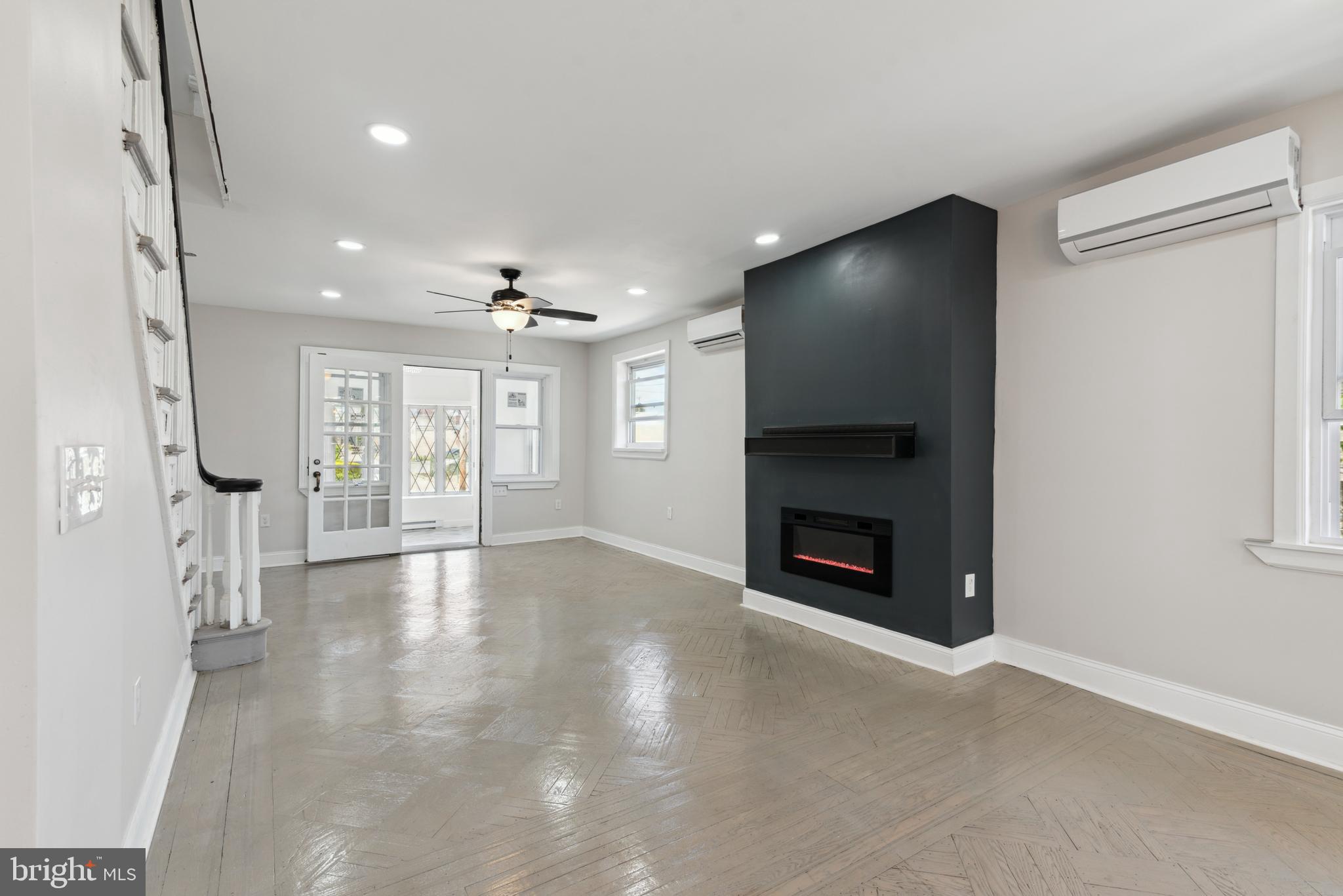 2414 77th Avenue Philadelphia, PA 19150 - Photo 2 of 25 a view of an empty room with window and fire place