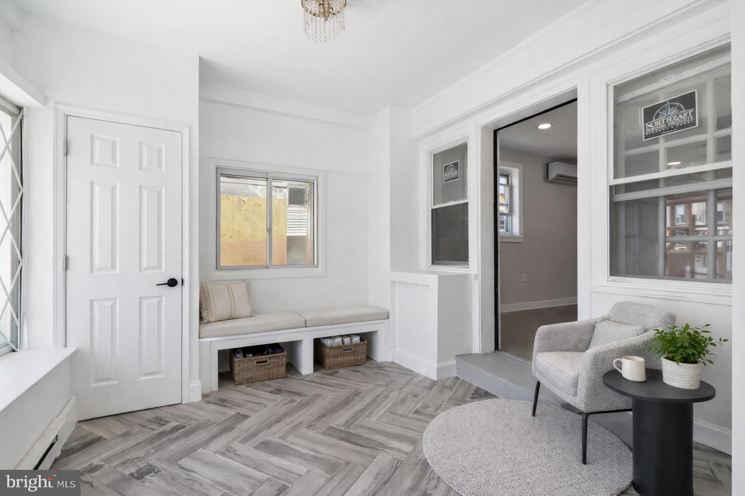 2414 77th Avenue Philadelphia, PA 19150 - Photo 22 of 25 a living room with furniture a window and a potted plant
