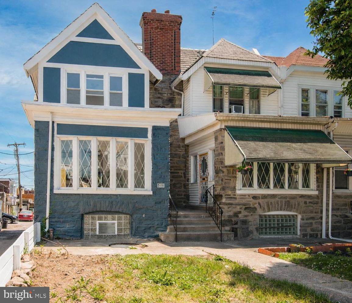 2414 77th Avenue Philadelphia, PA 19150 - Photo 24 of 25 a front view of a house with a yard