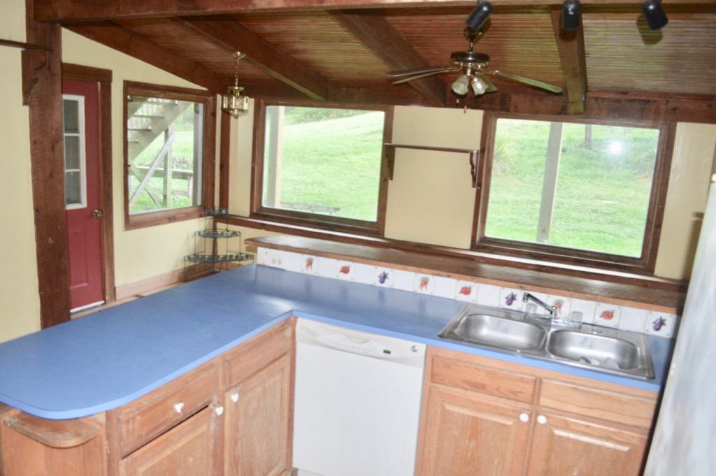 292 Moore Road Northeast Floyd, VA 24091 - Photo 14 of 65 a view of a kitchen with a sink and a window