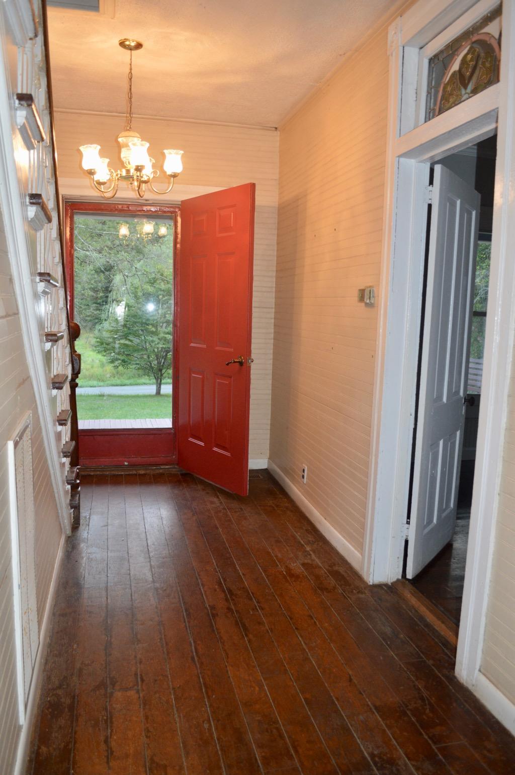 292 Moore Road Northeast Floyd, VA 24091 - Photo 22 of 65 a view of a room with wooden floor and a fireplace