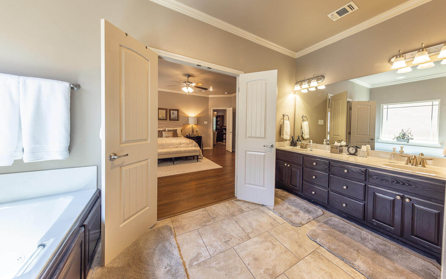 4402 108th Street, Unit 10 Lubbock, TX 79424 - Photo 12 of 21 a large bathroom with a large tub and sink