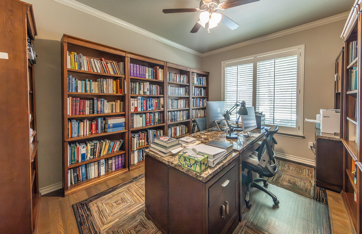 4402 108th Street, Unit 10 Lubbock, TX 79424 - Photo 13 of 21 a view of a workspace with furniture and a book shelf