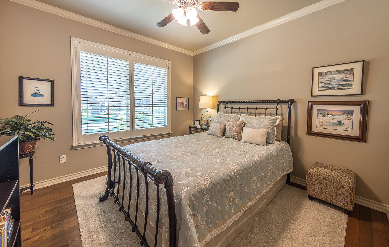 4402 108th Street, Unit 10 Lubbock, TX 79424 - Photo 15 of 21 a bedroom with a bed and a chandelier