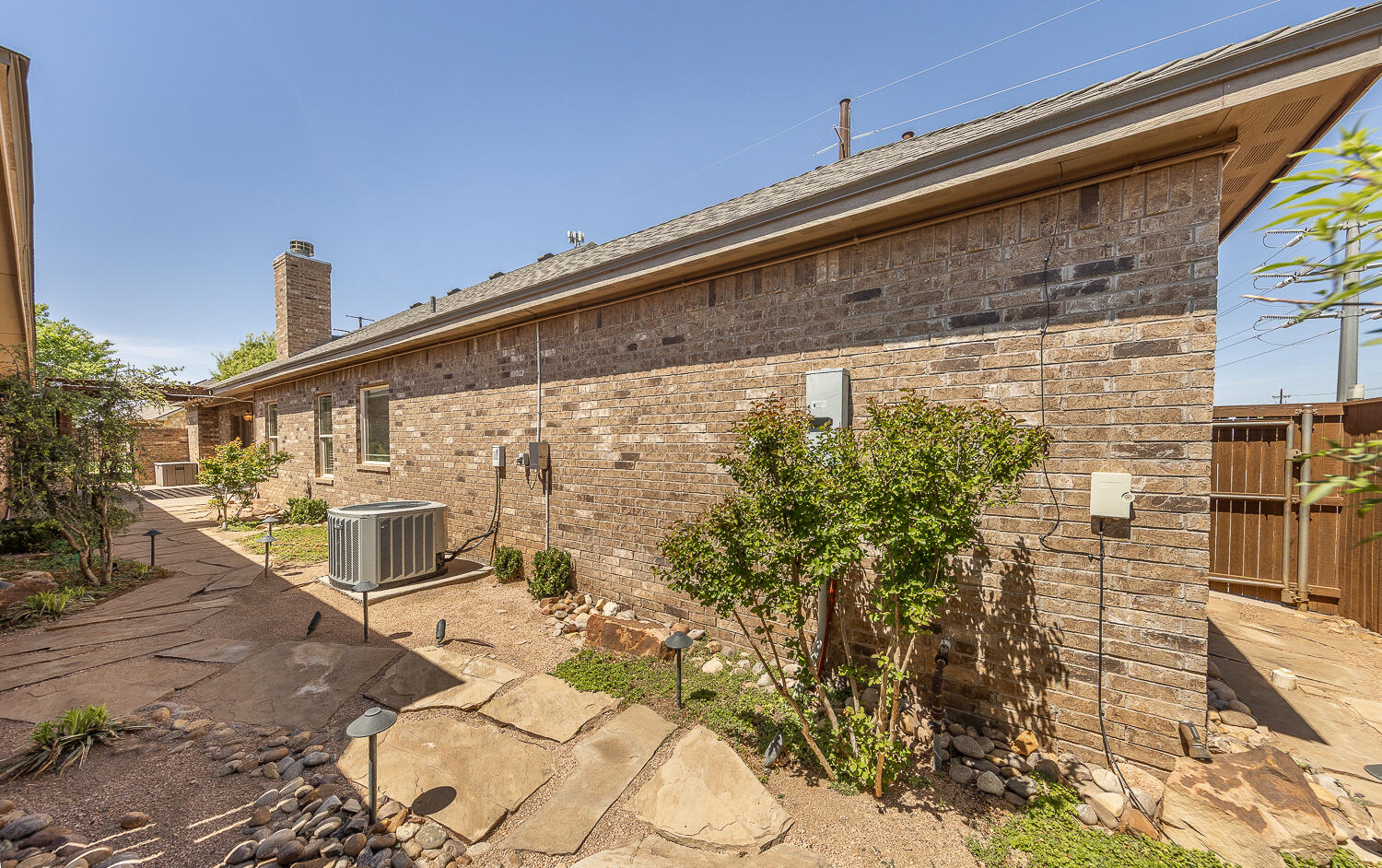 4402 108th Street, Unit 10 Lubbock, TX 79424 - Photo 20 of 21 a front view of a house with a yard