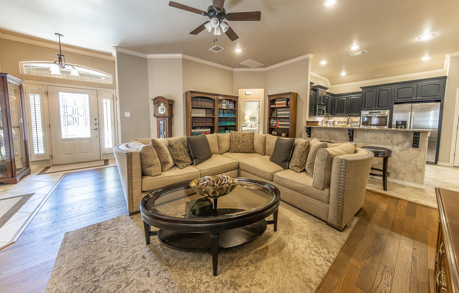 4402 108th Street, Unit 10 Lubbock, TX 79424 - Photo 2 of 21 a living room with furniture and a wooden floor