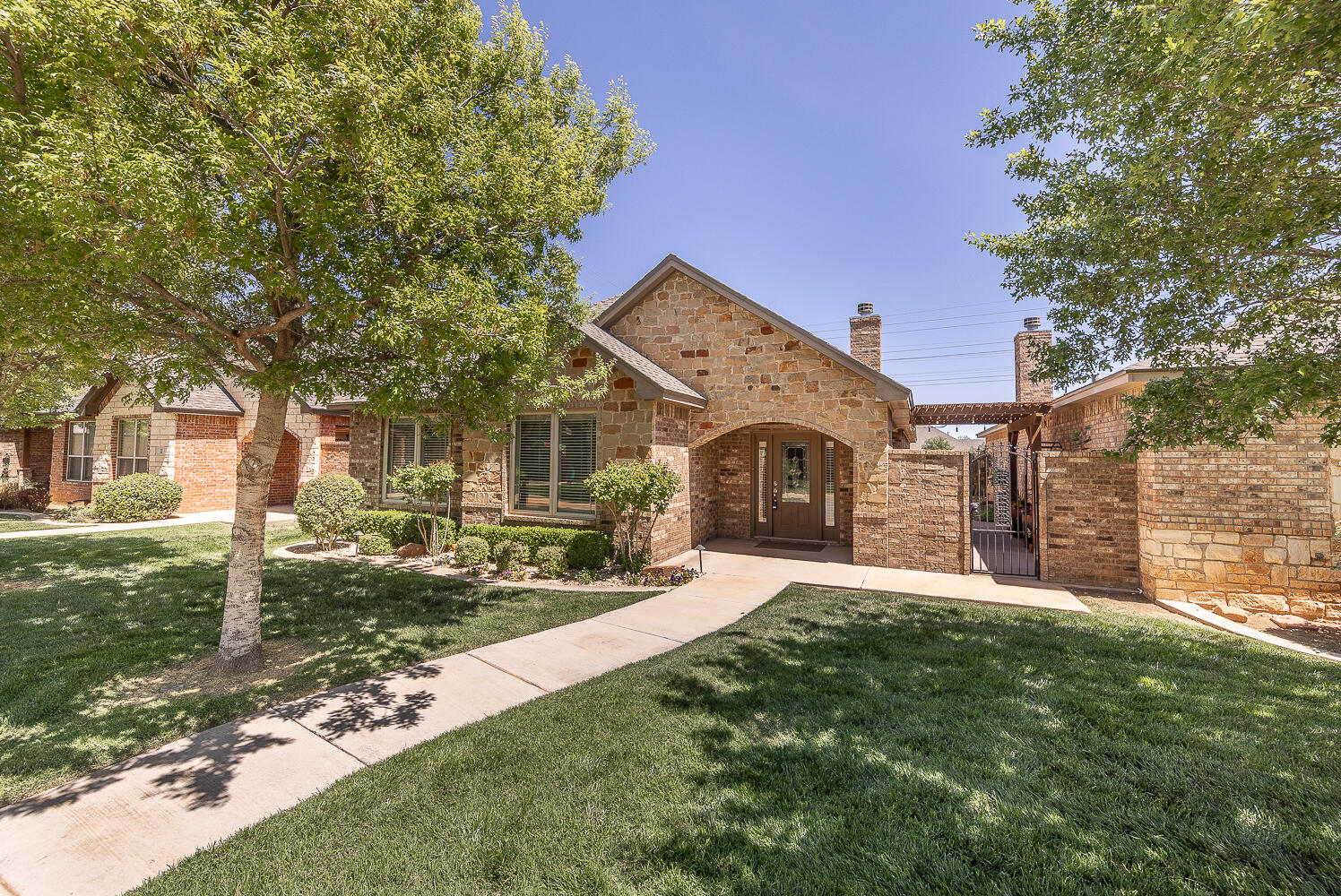 4402 108th Street, Unit 10 Lubbock, TX 79424 - Photo 21 of 21 a front view of a house with a yard