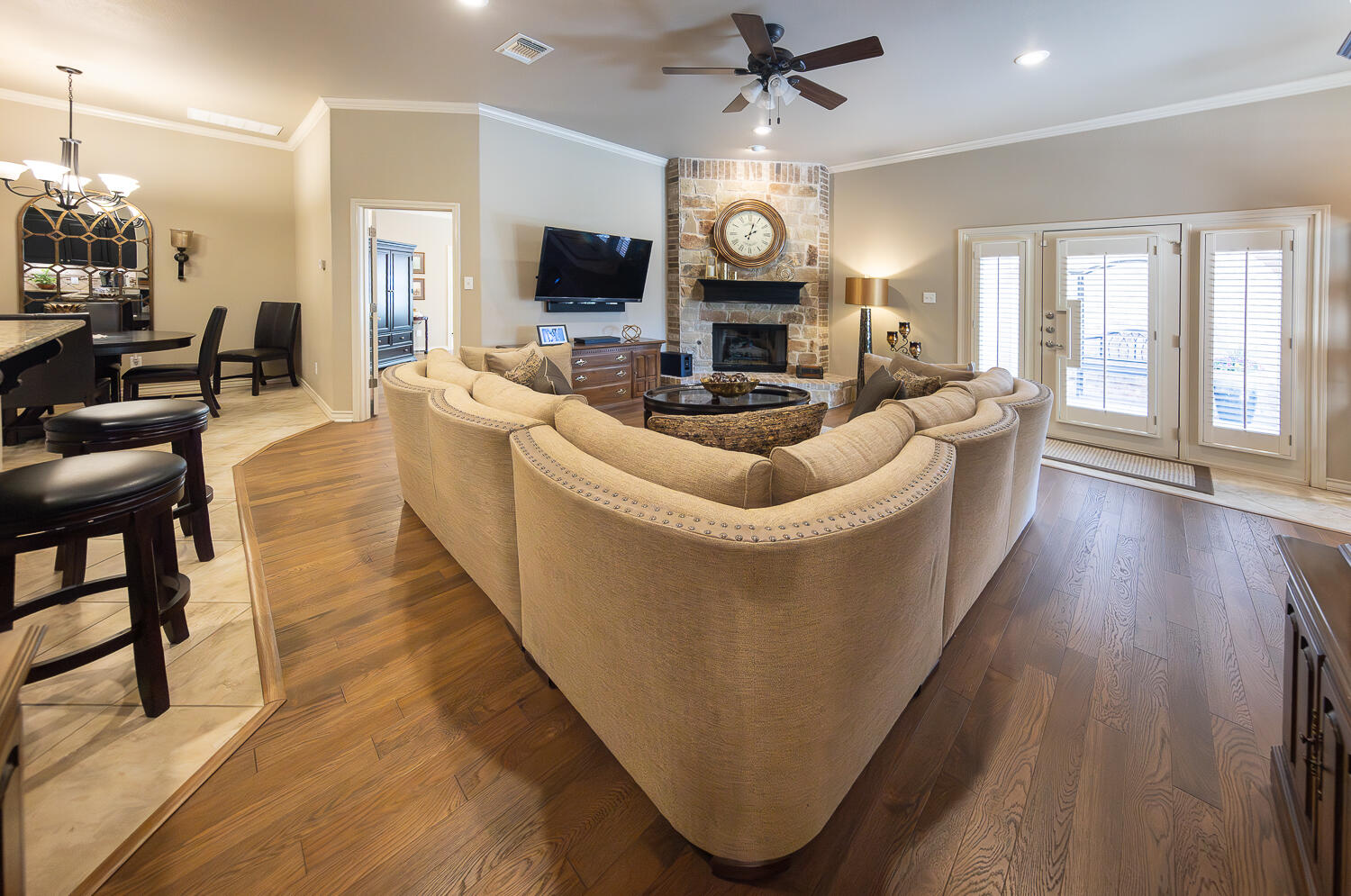 4402 108th Street, Unit 10 Lubbock, TX 79424 - Photo 5 of 21 a living room with fireplace furniture and a flat screen tv