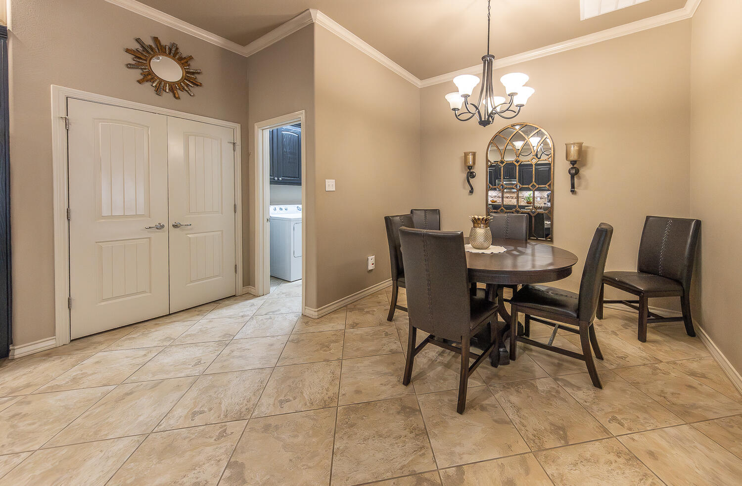 4402 108th Street, Unit 10 Lubbock, TX 79424 - Photo 7 of 21 a view of a dining room with furniture and chandelier