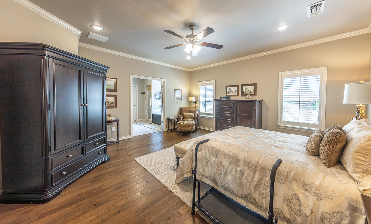 4402 108th Street, Unit 10 Lubbock, TX 79424 - Photo 9 of 21 a bedroom with a large bed and flat tv