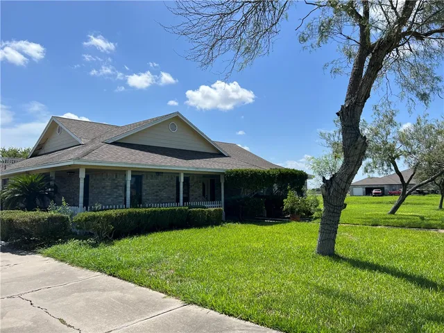 a view of a house with a garden