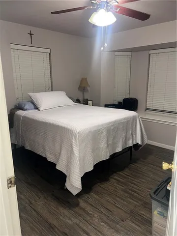 a bedroom with a bed and a mirror