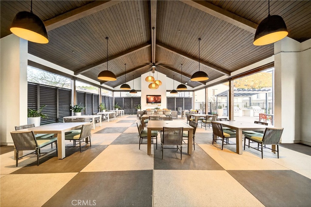 35165 Rangpur Lane Fallbrook, CA 92028 - Photo 36 of 42 a view of a patio with dining table and chairs with a barbeque grill