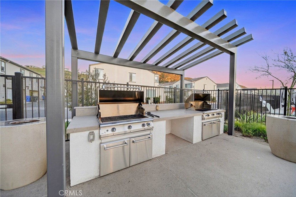 35165 Rangpur Lane Fallbrook, CA 92028 - Photo 37 of 42 a kitchen with white cabinets and white appliances