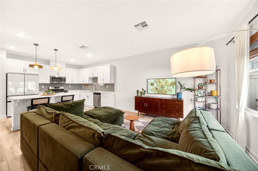 35165 Rangpur Lane Fallbrook, CA 92028 - Photo 4 of 42 a living room with furniture and a view of kitchen