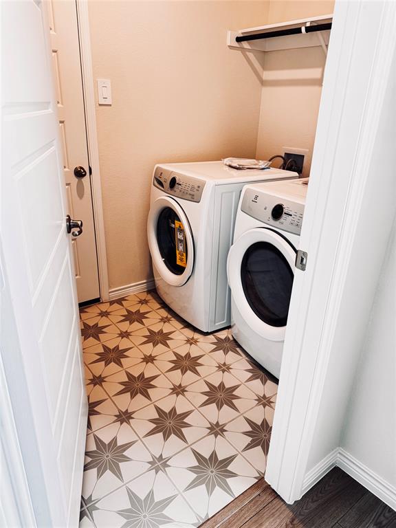 2625 Lewisville Road Celina, TX 75009 - Photo 5 of 7 Laundry area featuring patterned tile flooring, a built-in shelf, and a hanging rod