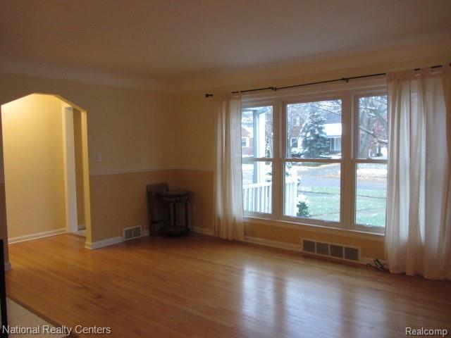 2926 Bembridge Road Royal Oak, MI 48073 - Photo 2 of 22 Living Room with exposed hardwood floors, newer windows