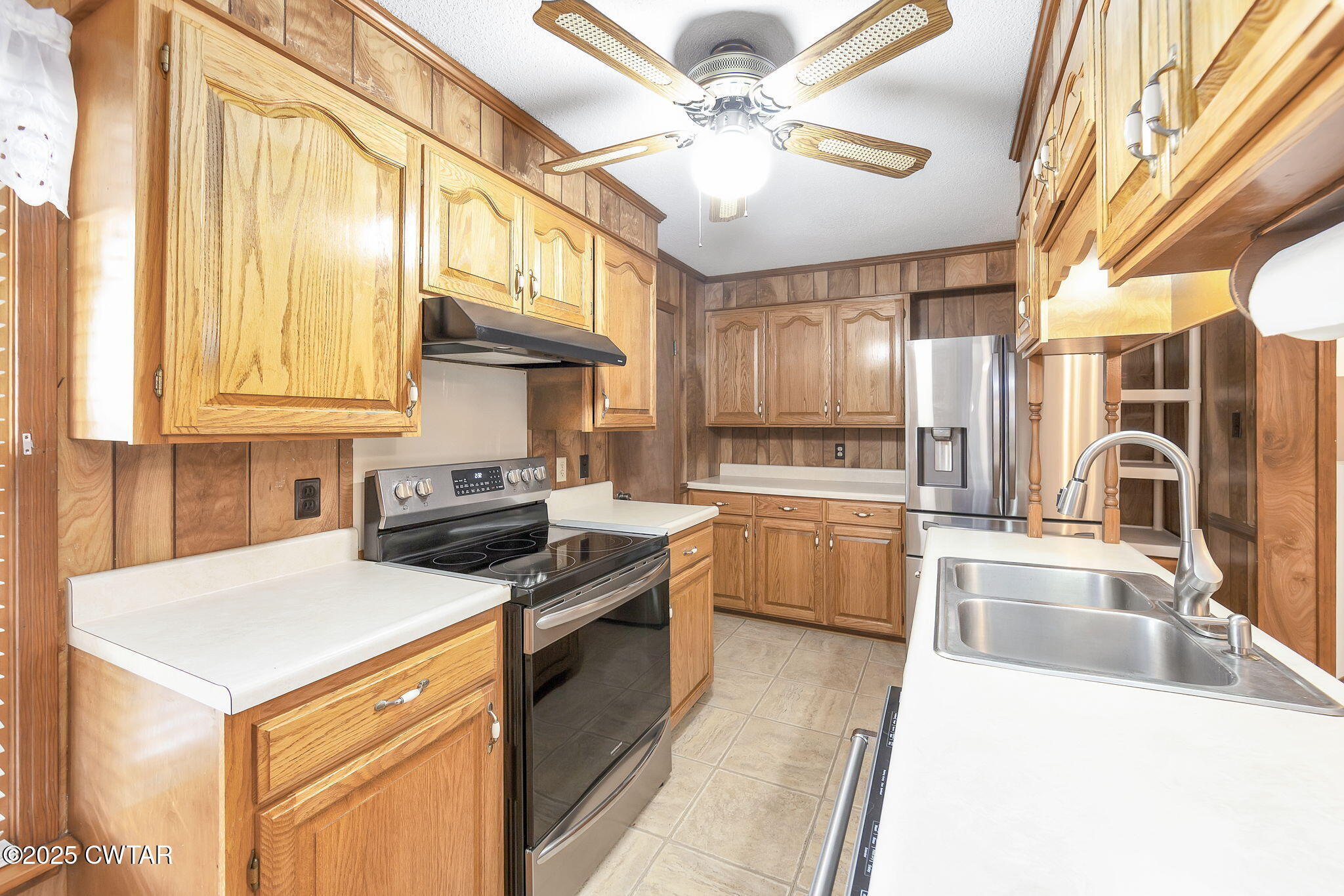 404 Callis Drive Rutherford, TN 38369 - Photo 20 of 39 a kitchen with stainless steel appliances granite countertop a sink a stove and a refrigerator