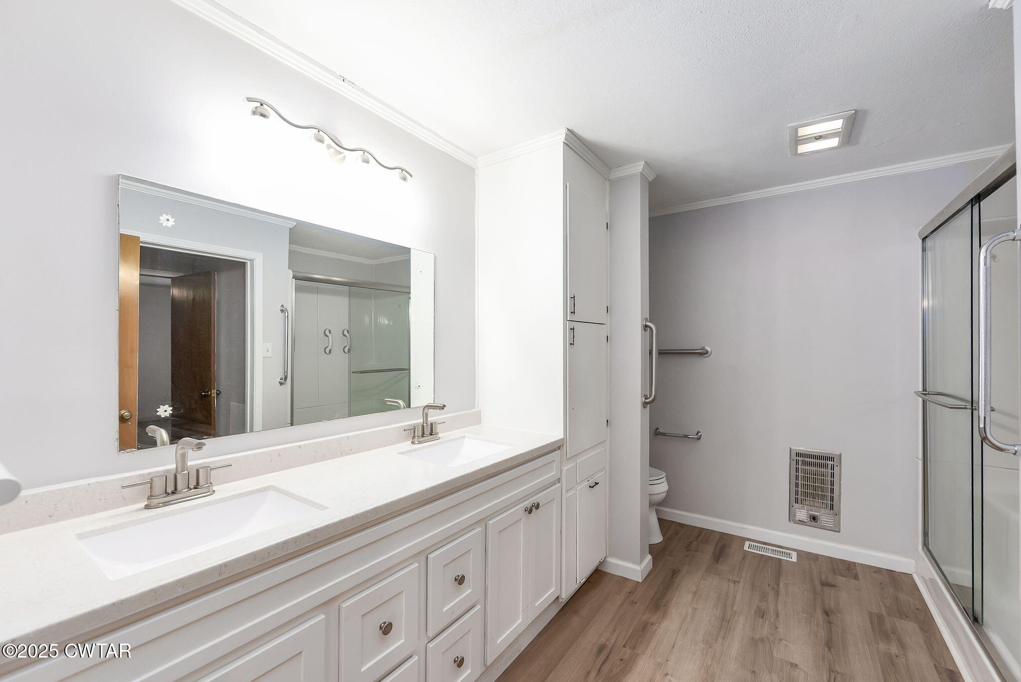404 Callis Drive Rutherford, TN 38369 - Photo 24 of 39 a bathroom with double vanity sink and mirror