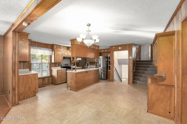 a view of a kitchen with furniture and a kitchen