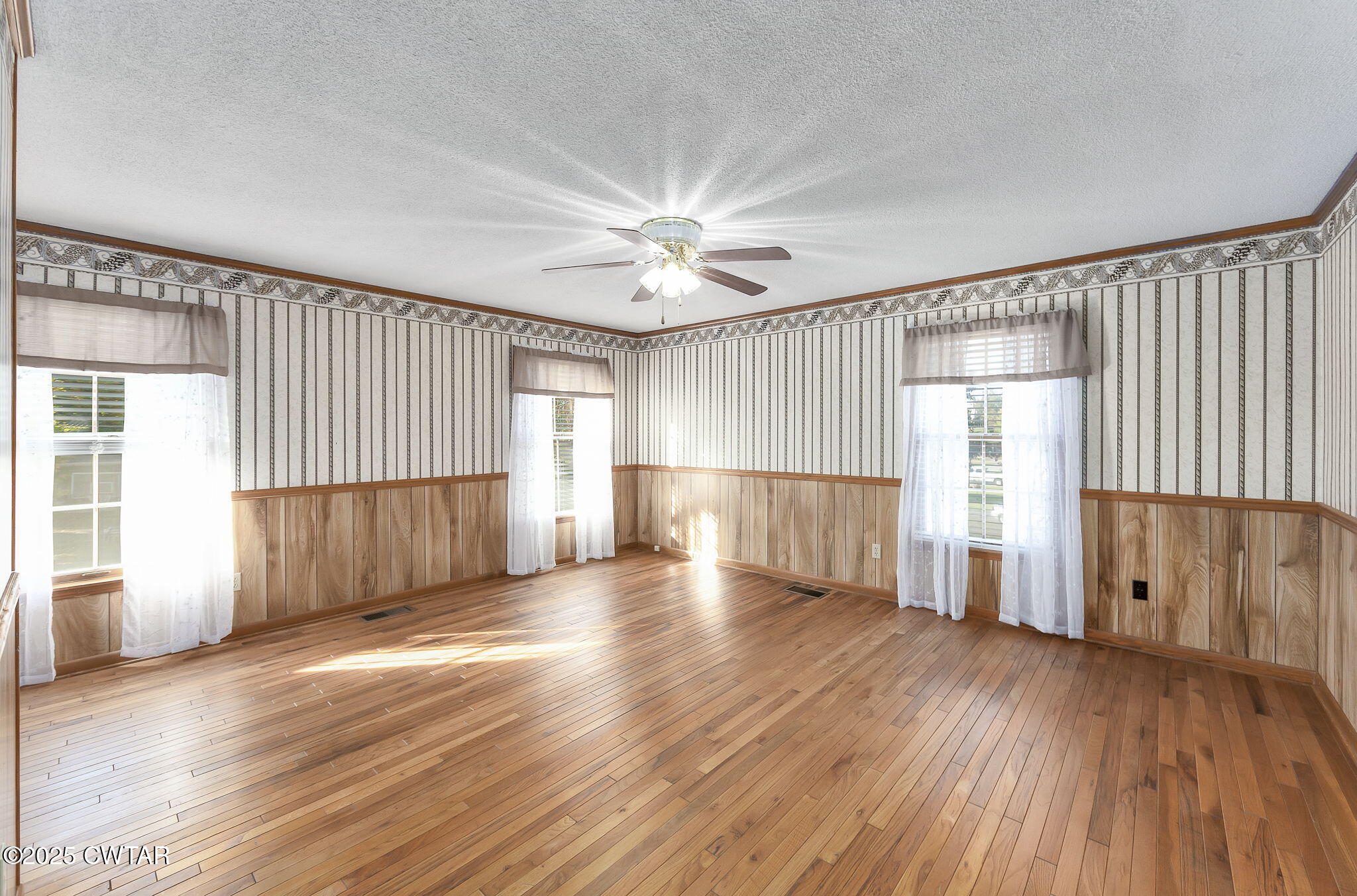 404 Callis Drive Rutherford, TN 38369 - Photo 27 of 39 an empty room with wooden floor and windows