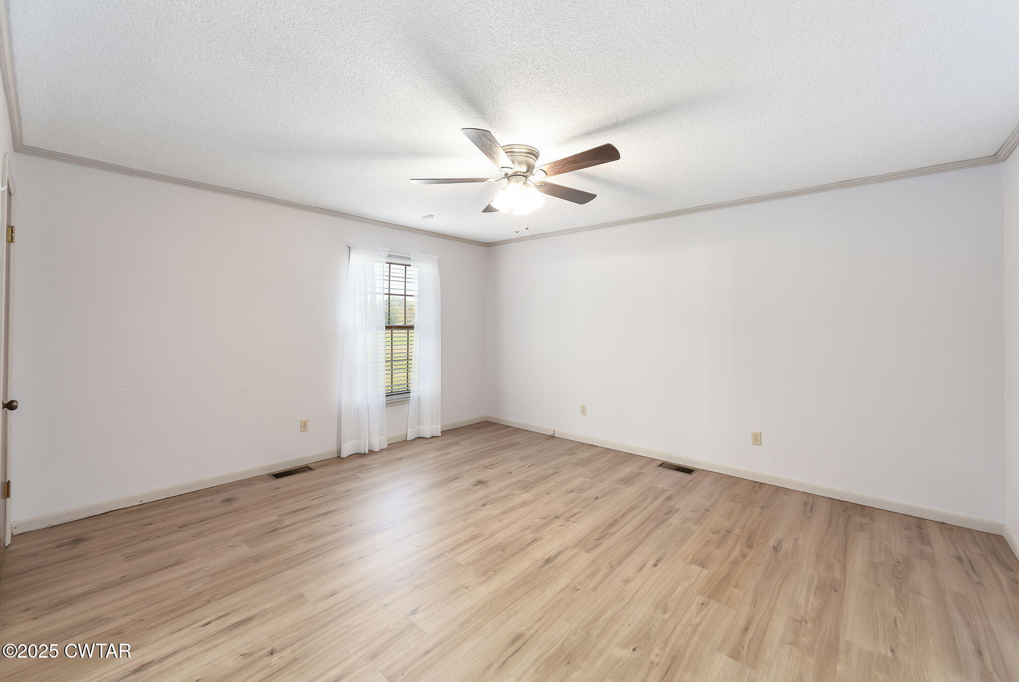 404 Callis Drive Rutherford, TN 38369 - Photo 29 of 39 an empty room with wooden floor and ceiling fan