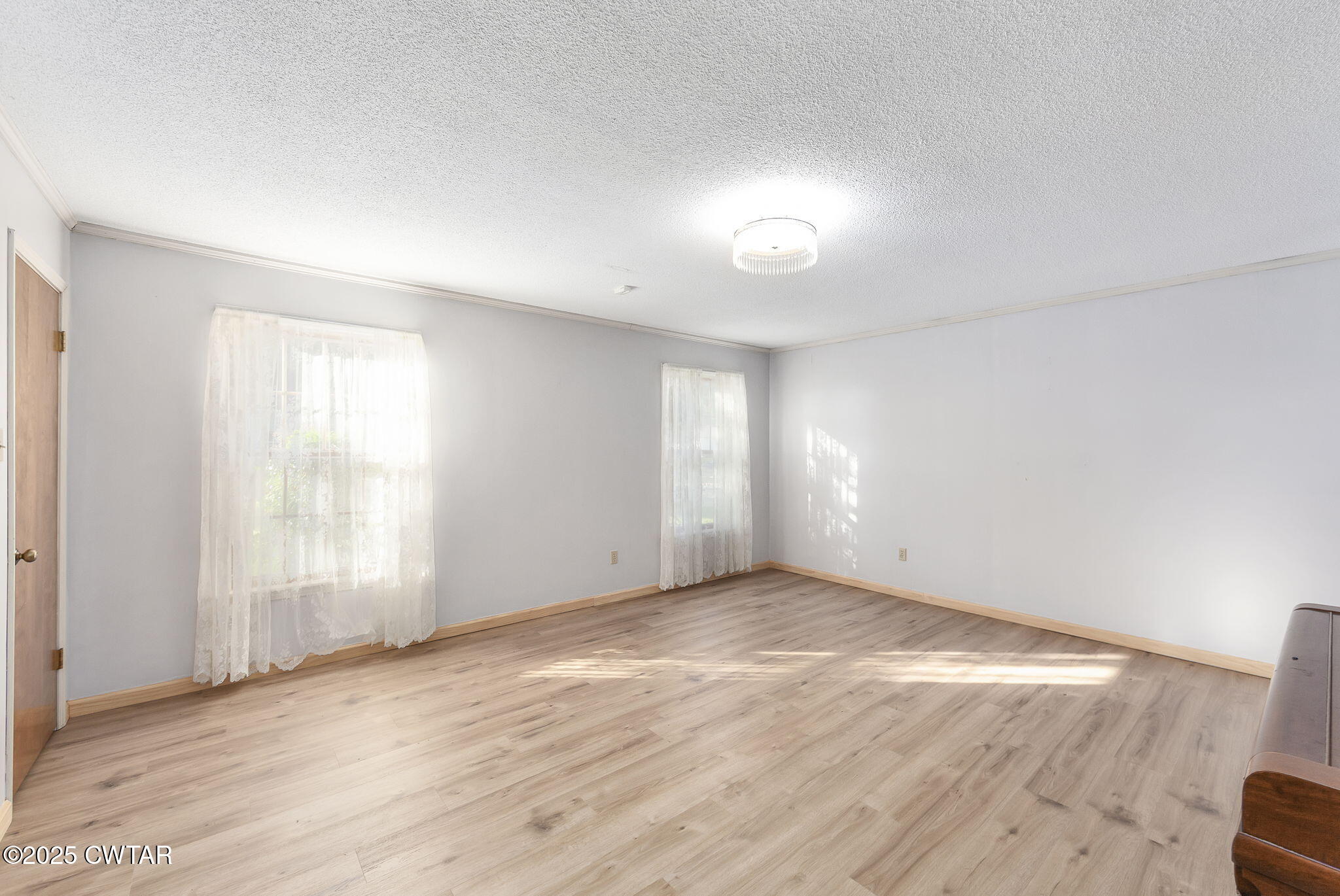 404 Callis Drive Rutherford, TN 38369 - Photo 30 of 39 an empty room with wooden floor and windows