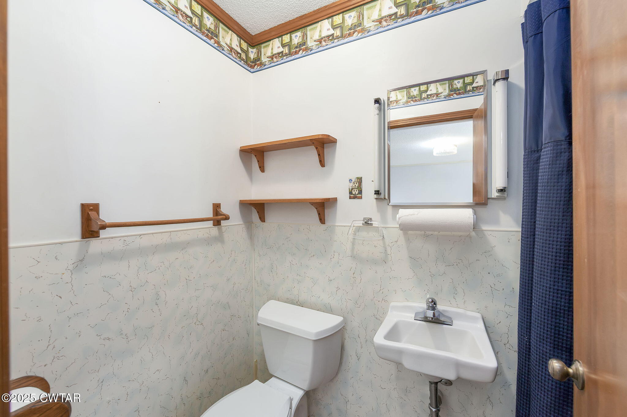 404 Callis Drive Rutherford, TN 38369 - Photo 31 of 39 a bathroom with a toilet sink and mirror