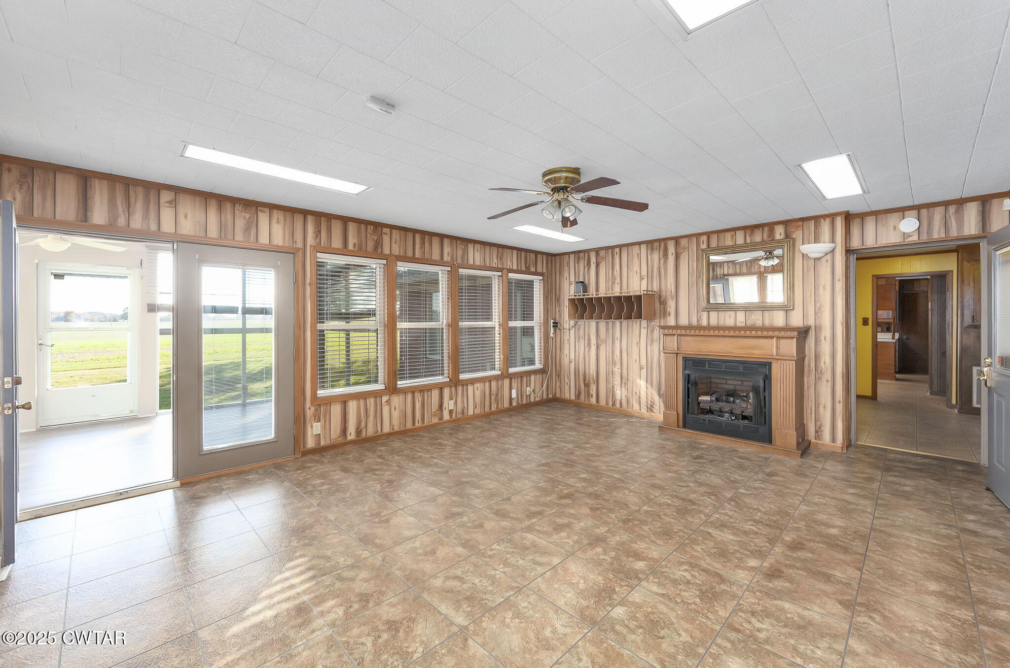 404 Callis Drive Rutherford, TN 38369 - Photo 34 of 39 a view of an empty room with a fireplace and a window