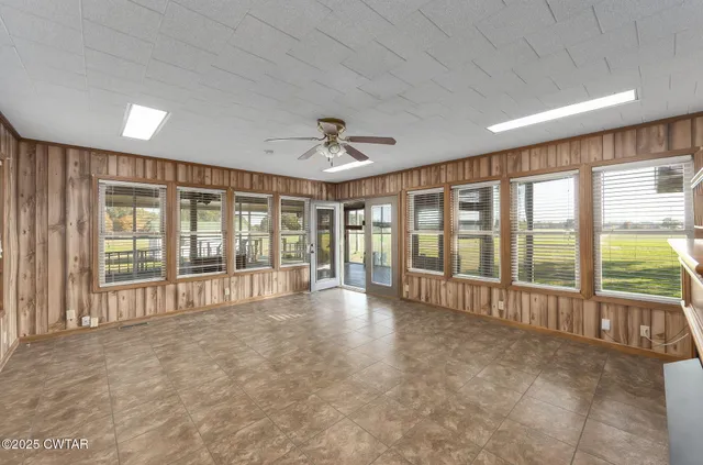 a view of an empty room with a large window