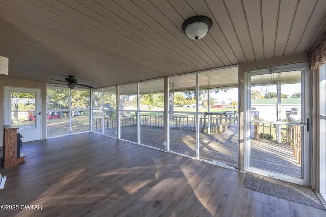 a room with wooden floor and furniture