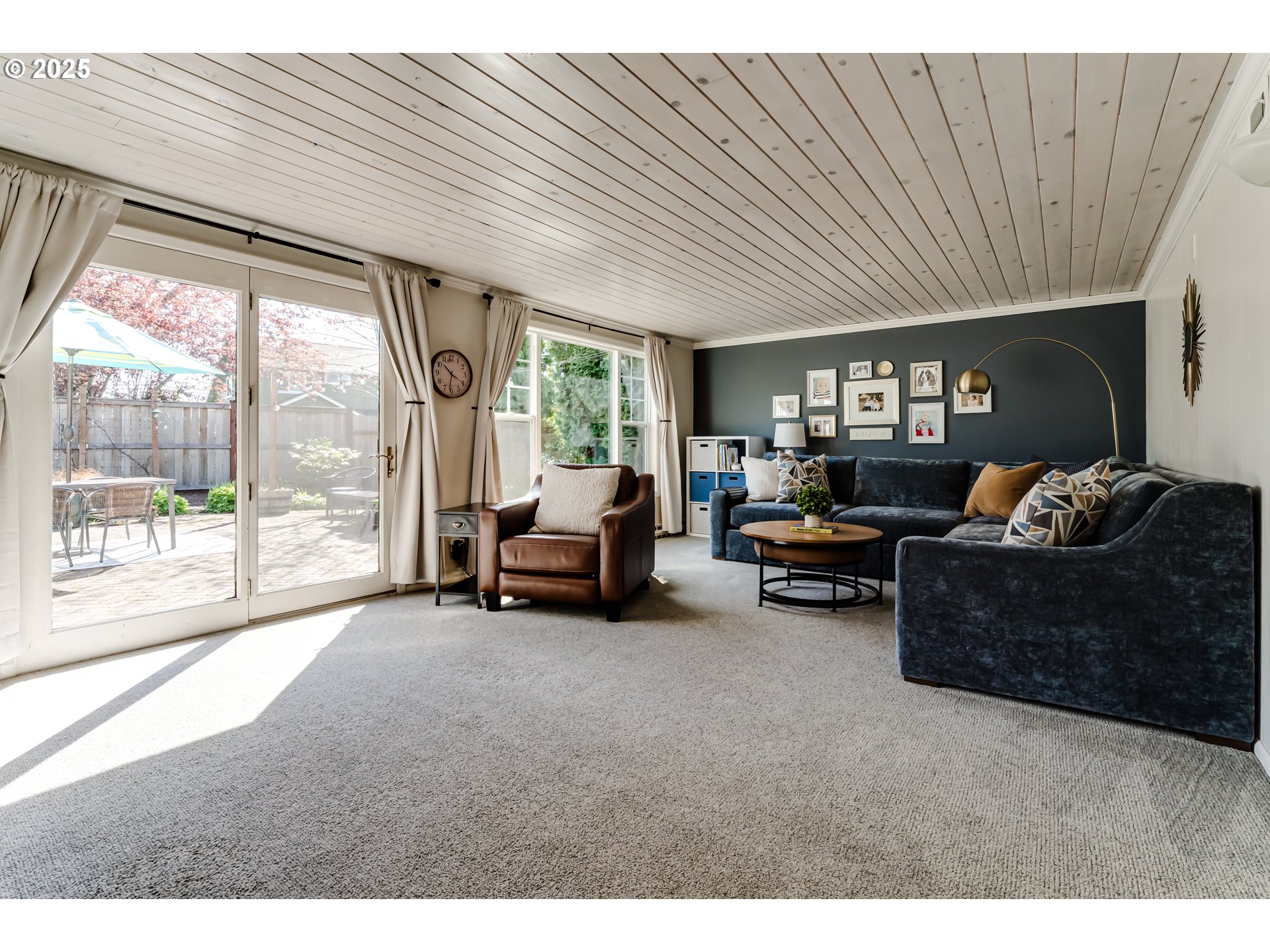 445 Hazel Court Eugene, OR 97401 - Photo 14 of 40 a living room with furniture and a floor to ceiling window