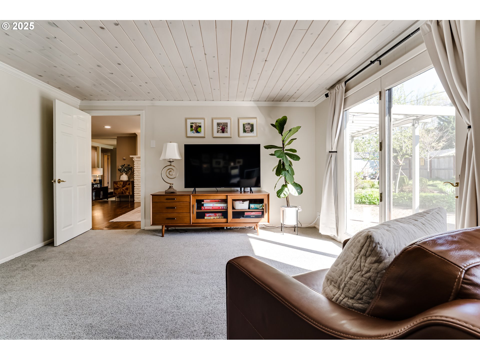 445 Hazel Court Eugene, OR 97401 - Photo 15 of 40 a living room with furniture and a flat screen tv