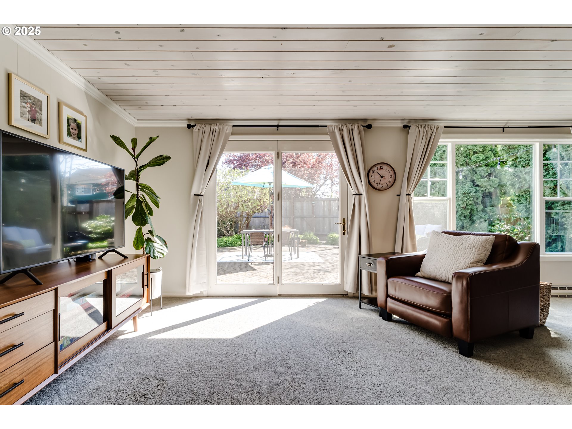445 Hazel Court Eugene, OR 97401 - Photo 16 of 40 a living room with furniture and a flat screen tv