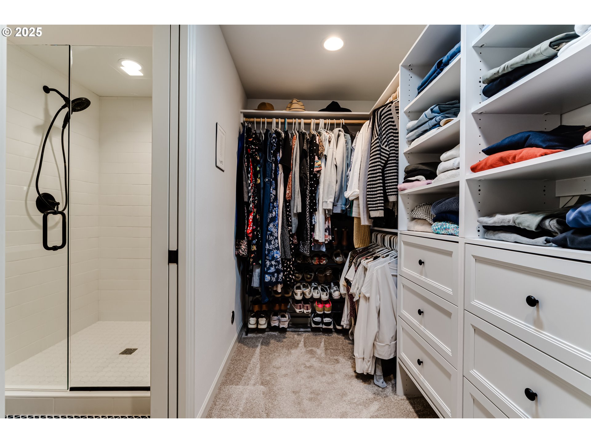 445 Hazel Court Eugene, OR 97401 - Photo 22 of 40 a view of walk in closet with clothes and shoes