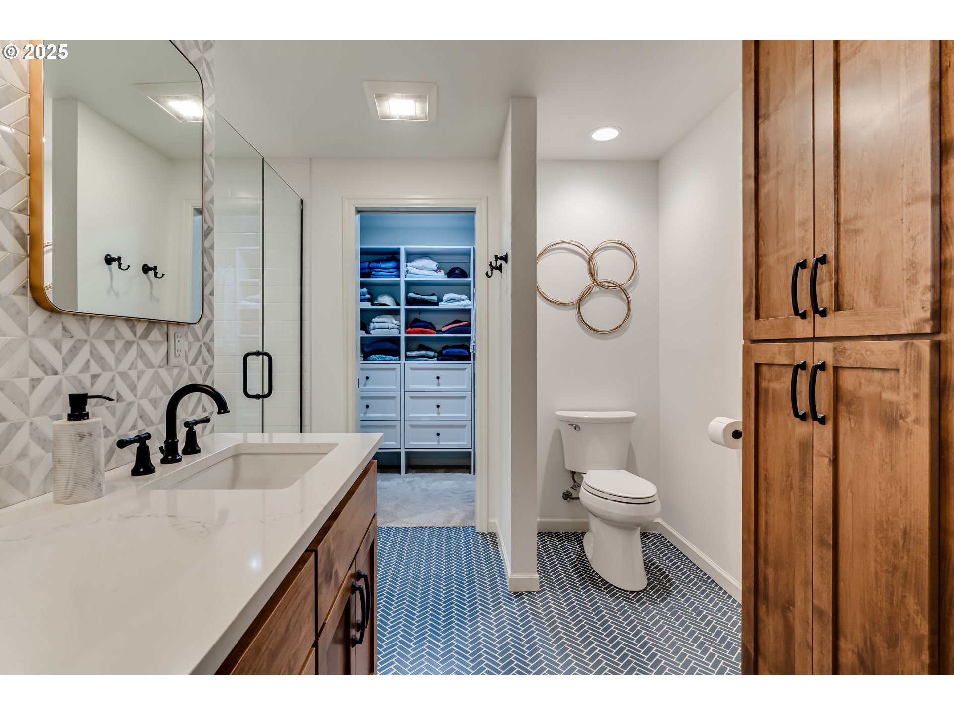 445 Hazel Court Eugene, OR 97401 - Photo 23 of 40 a bathroom with a sink toilet a mirror and shower