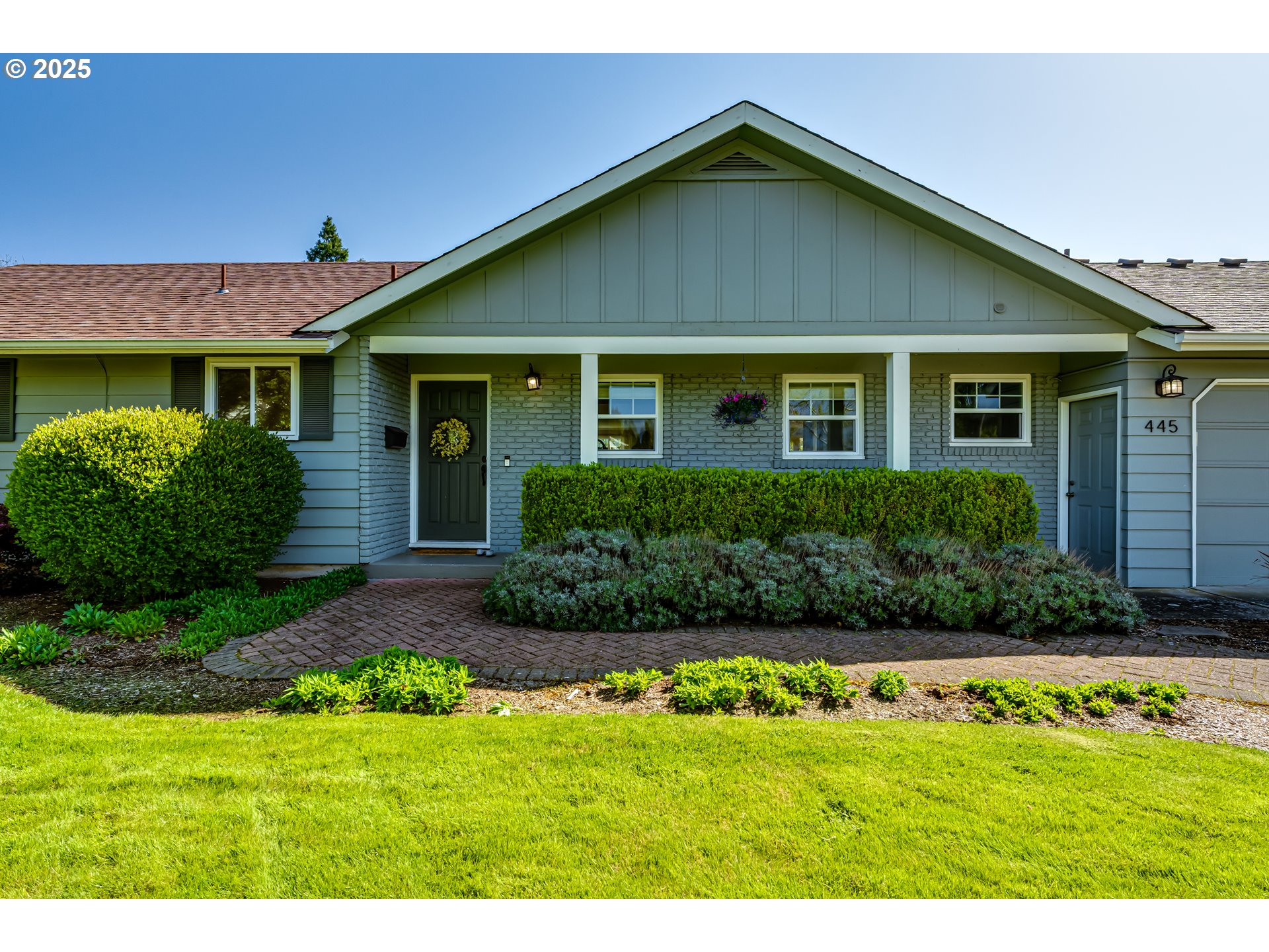 445 Hazel Court Eugene, OR 97401 - Photo 3 of 40 a front view of a house with a garden