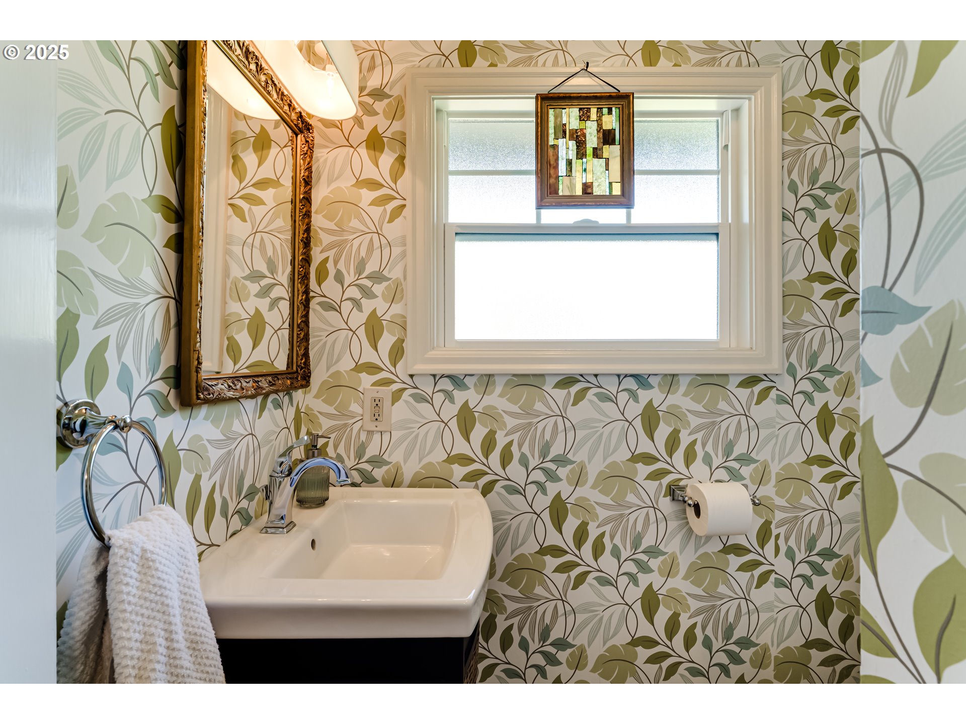 445 Hazel Court Eugene, OR 97401 - Photo 31 of 40 a bathroom with a sink a mirror and a window