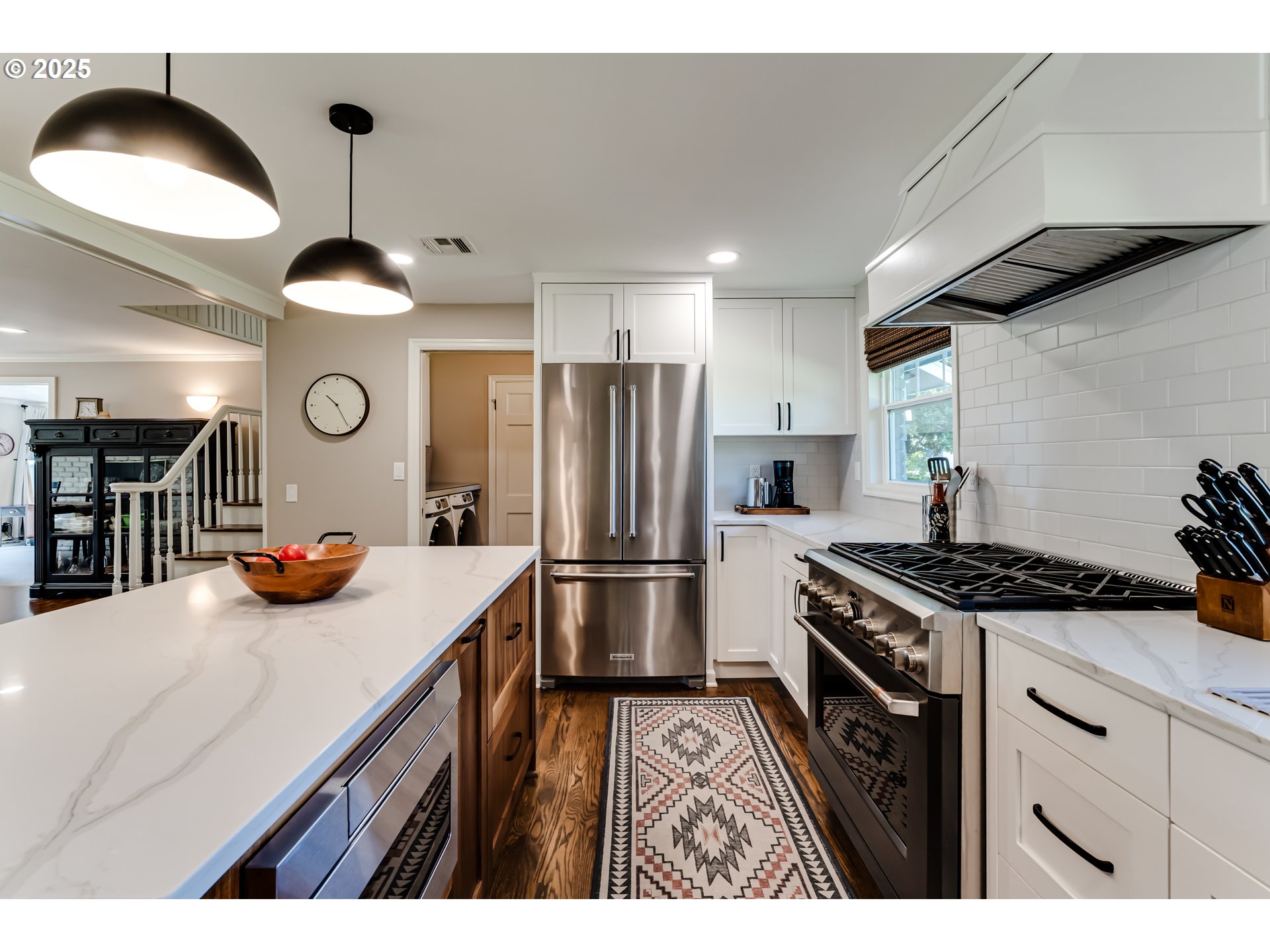 445 Hazel Court Eugene, OR 97401 - Photo 6 of 40 a kitchen with cabinets and stainless steel appliances